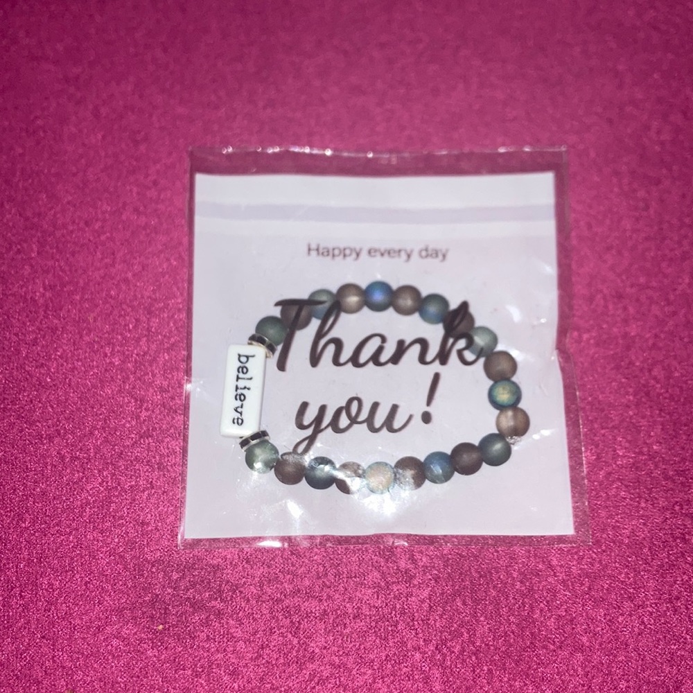 This is a space bracelet, on the stone it says believe, it  stretches out .